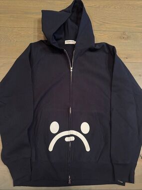 Bape Baby Milo Black Zip-Up Hoodie with White Sad Face Graphic